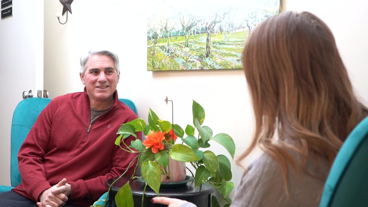 A patient smiling during a relaxed visit in our Winchester office