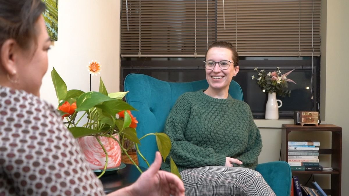 A clinician smiling during a supportive conversation